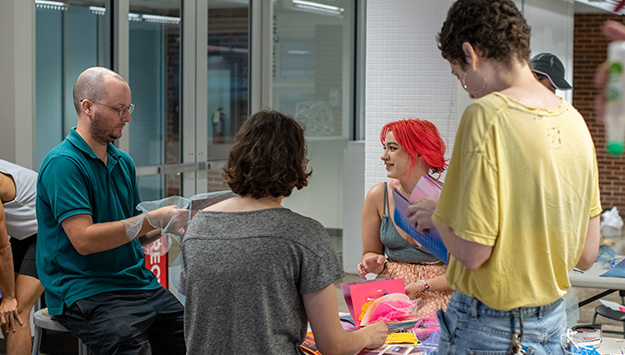Graduate students participate in a drawing and zine workshop based on the exhibit, I Can See Clearly Now